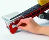 A hand is shown turning a crank on a red and white conveyor belt trailer. Náhled obrázku produktu