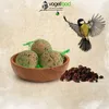 A bird food product with a bird flying towards it, set against a textured background. Produktbild-Vorschau