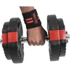 A person's hand wearing a wrist wrap is holding a dumbbell. Náhľad obrázku produktu