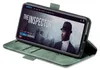 A smartphone in a green flip case is displayed on a white background, showing a movie poster on its screen. Produktbild-Vorschau