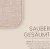 A close-up of a textured beige fabric with text describing its features. Anteprima dell’immagine prodotto