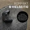 A black game controller rests on a textured gray pouf, with text overlays. Produktbild-Vorschau