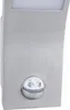 A close-up, front-facing view of a silver LED lamp with an integrated infrared motion sensor. Produktbild-Vorschau