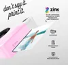 A pink instant camera printing a photo. Podgląd zdjęcia produktu