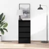 A black chest of drawers with four drawers is shown in a room with a plant and a floor lamp. Anteprima dell’immagine prodotto
