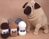 A knitted pug toy sits next to several balls of YarnArt Dolce yarn in various colors. Náhľad obrázku produktu
