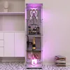 A white glass display cabinet with purple LED lighting, showcasing various items on its shelves, placed in a room with a patterned floor. Produktbild-Vorschau