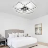 A bedroom with a bed, nightstand, and a modern ceiling light. Podgląd zdjęcia produktu
