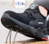 A close-up shot of a black safety shoe with a red sole, demonstrating its protective features against sharp objects. Produktbild-Vorschau