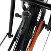 Close-up of a resistance knob on a black fitness machine with an orange accent. Podgląd zdjęcia produktu