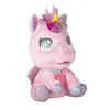 A pink plush unicorn toy is sitting and facing the viewer. Podgląd zdjęcia produktu