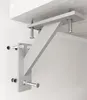 A close-up view of a metal shelf bracket system attached to a wooden surface and a wall. Produktbild-Vorschau