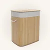 A laundry basket made of bamboo with a fabric liner and lid. Podgląd zdjęcia produktu