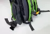 Close-up view of the back straps and mesh padding of a green and gray backpack. Náhled obrázku produktu