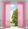 Two pink sheer curtains are hung on a window, framing a view of a large green tree and a blue sky with clouds. Produktbild-Vorschau