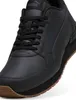 A close-up, studio shot of a black Puma sneaker. Voir les images du produit