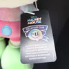 A close-up of a Disney Mickey Mouse Collectors Club tag attached to a plush toy. Voir les images du produit