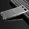 A transparent phone case is placed on a black reflective surface, with a portion of a black keyboard visible in the background. Produktbild-Vorschau