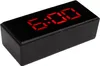 A digital alarm clock with a red LED display showing 6:00. Voir les images du produit