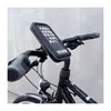 A close-up shot of a bicycle handlebar with a phone holder attached. Voir les images du produit