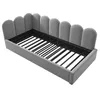 A gray upholstered bed frame with a slatted base, shown from a diagonal angle against a white background. Náhled obrázku produktu