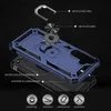 An exploded view diagram of a blue phone case, showing its different layers and components, with labels and icons indicating features. Produktbild-Vorschau