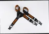 A pair of black and orange Stihl suspenders are laid out on a white background. Produktbild-Vorschau