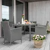 An outdoor patio set with chairs and a table, decorated with flowers. Náhľad obrázku produktu