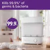 A Philips Avent sterilizer is shown in a bright, indoor setting, possibly a kitchen or nursery. Produktbild-Vorschau