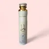 A product shot of an air freshener bottle against a light pink background. Podgląd zdjęcia produktu