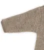 A close-up of a baby overall sleeve. Produktbild-Vorschau