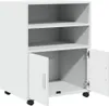 A white roll-out cabinet with two shelves and a cabinet at the bottom with two doors, one of which is open. Podgląd zdjęcia produktu
