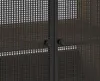 Close-up of two black cabinet doors with circular perforations and round black handles. Podgląd zdjęcia produktu