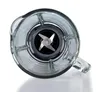 A close-up, top-down view of the blades inside a blender jar. Voir les images du produit