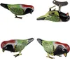Four views of a tin toy bird. Produktbild-Vorschau
