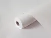 A roll of white matte adhesive film is shown on a light gray background. Produktbild-Vorschau