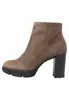 A single brown suede ankle boot with a black block heel and platform sole is shown against a white background. Produktbild-Vorschau