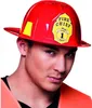 A man wearing a red firefighter helmet with a yellow badge that says "FIRE CHIEF". Produktbild-Vorschau