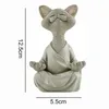 A statue of a cat meditating. Produktbild-Vorschau