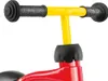 Close-up of the handlebars and front of a red ride-on toy. Produktbild-Vorschau