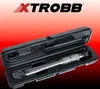 A torque wrench is displayed in its black case against a red and black gradient background. Náhľad obrázku produktu