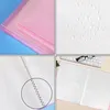 A collage of four images showing details of a pink diamond painting accessory album. The top left shows the exterior of the album. The top right shows a close-up of a textured surface with water droplets. The bottom left shows a close-up of the binding and Produktbild-Vorschau