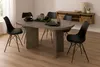 A dining room setting with an oval table and chairs, a sideboard in the background. Produktbild-Vorschau