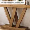 Close-up of the V-shaped wooden base of a console table. Podgląd zdjęcia produktu