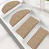 Several stair mats are placed on white stairs. Voir les images du produit