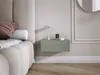 A bedroom scene with a bed and a floating nightstand. Voir les images du produit