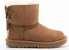 A side view of a single brown Ugg boot with a bow on the back, set against a white background. Produktbild-Vorschau