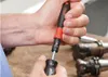 A person is holding and using a Wiha torque screwdriver. Náhľad obrázku produktu