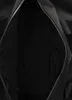 The inside of an open black duffel bag. Produktbild-Vorschau