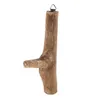 A single wooden hook made from a teak root, displayed against a white background. Náhled obrázku produktu